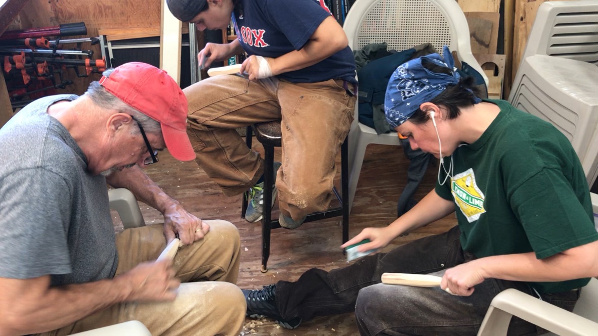 Students finishing their newly forged carving tools