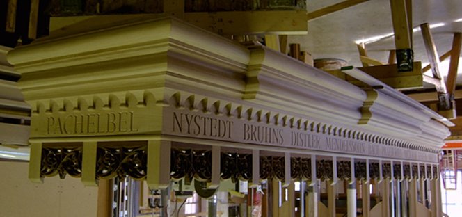 custom impost with wood carving and lettering 