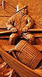 wood carved relief panel in white oak of fisherman